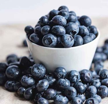 blueberries in white ceramic cup