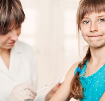 Girl receiving vaccine