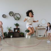 Three kids jumping rope