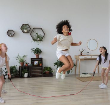 Three kids jumping rope