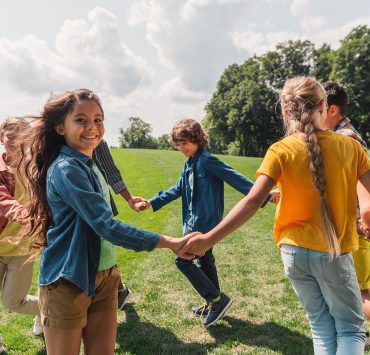 Happy kids holding hands
