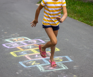 Children playing traditional games during a children's museum program in Texarkana