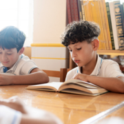 Family reading back-to-school books together before the first day of school