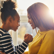 Parent and child talking together after school